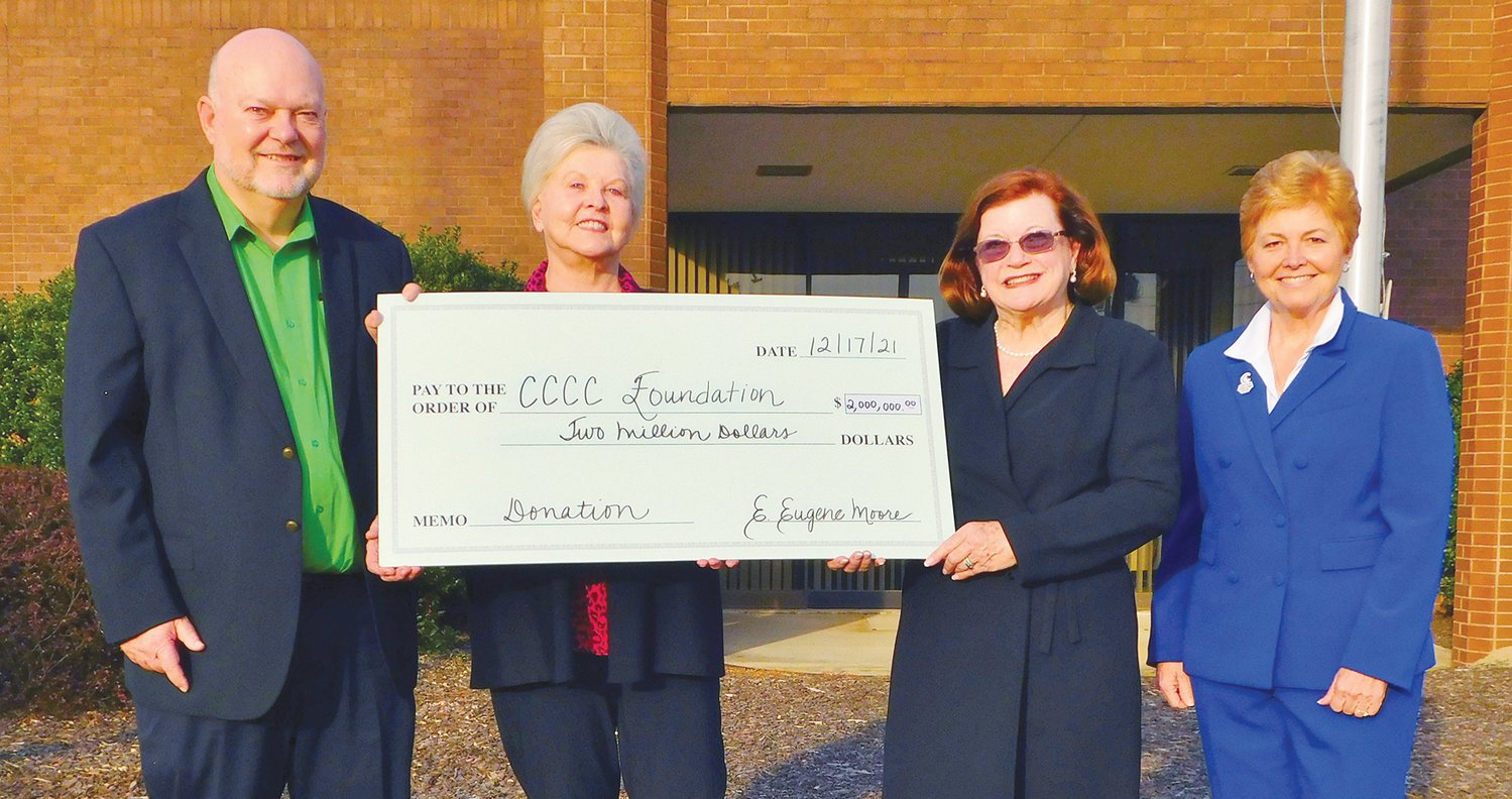 Central Carolina Community College alumnus E. Eugene Moore (left) is being recognized for his $2 million gift to his alma mater with the naming of the future E. Eugene Moore Manufacturing and Biotech Solutions Center in his honor. Pictured with Moore are, left to right: his wife, Ruby; CCCC Foundation Board Chair Lynda Turbeville; and CCCC President Dr. Lisa M. Chapman.